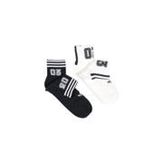 Black and white adidas originals men athletic socks with bold lettering, striped cuffs, and adidas logo for active wear