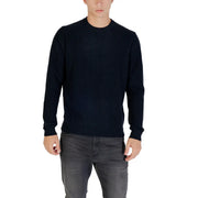 Navy blue crew neck sweater with ribbed cuffs and hem, likely made of cotton or a similar soft material.