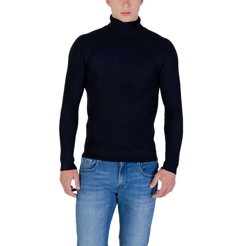 Black ribbed turtleneck sweater with a high neck and long sleeves.