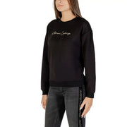 Armani Exchange women black long sleeve round neck sweatshirt with gold embroidered logo and repeating brand text on side seam