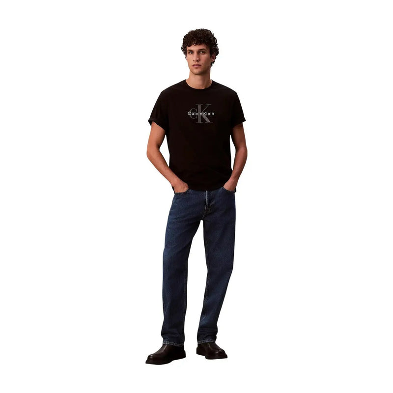 Black Calvin Klein t shirt made of soft fabric featuring a silver logo on the chest for casual wear