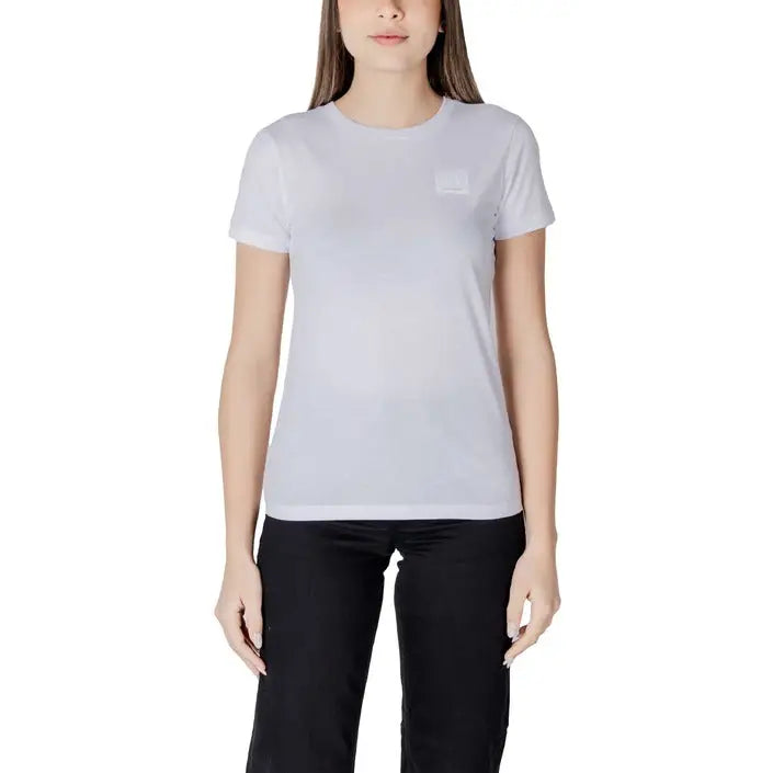 Woman wearing Black Crewneck T Shirt with white T shirt and black pants on a model