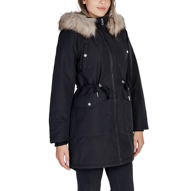 Black long hooded women’s fall winter jacket with front pockets, black winter parka with faux fur-lined hood and silver snap buttons