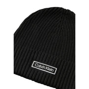 Black ribbed calvin klein beanie with white logo.