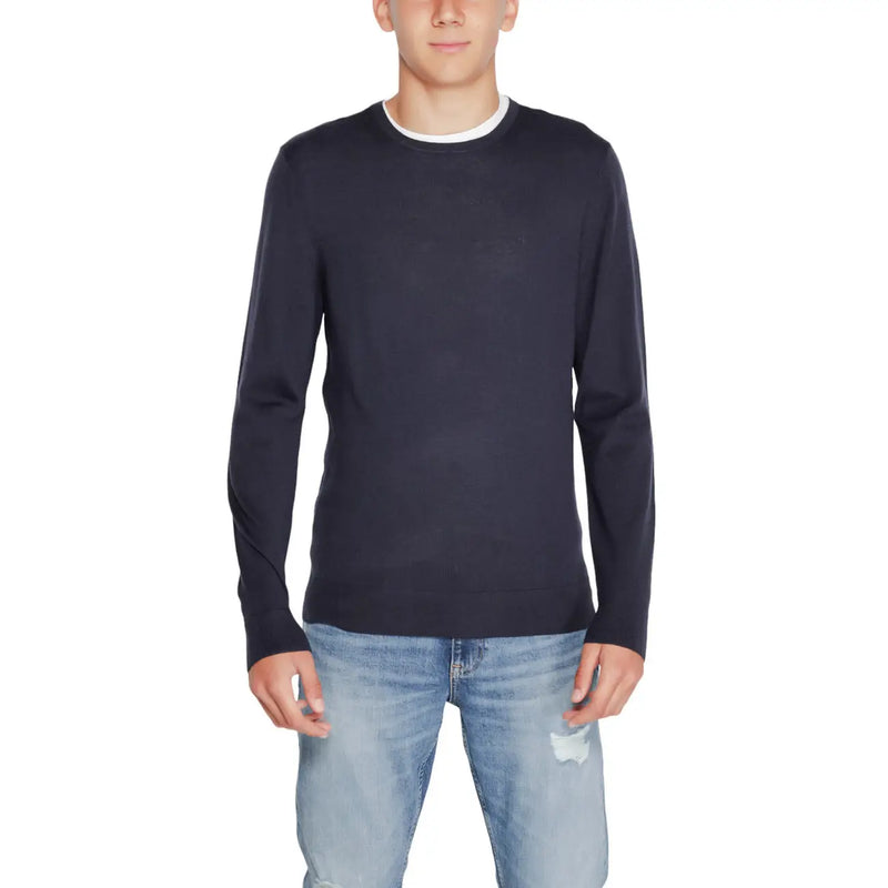Navy blue crew neck sweater with white trim, likely made of cotton or polyester blend.