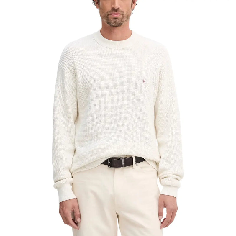 White textured crew neck sweater with logo detail on left chest.