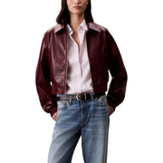 Burgundy leather jacket over white shirt and blue jeans from Calvin Klein Jeans Bordeaux blazer