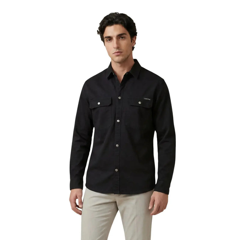 Calvin klein jeans men shirt in black long-sleeved button-up design with two chest pockets and silver buttons