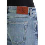 Light-wash denim jeans back view featuring brown leather Calvin Klein brand patch classic 100 cotton material