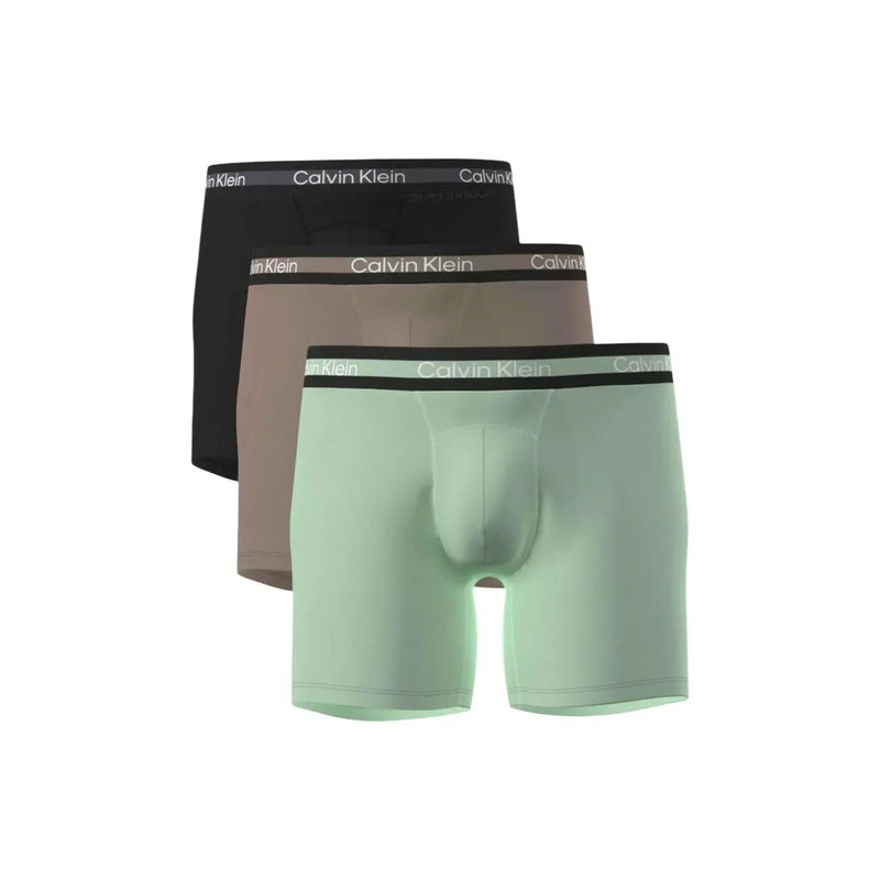 Set mit drei Calvin Klein Herren-Boxershorts aus Baumwollstretch in Schwarz, Beige und Mintgrün mit Markenbund.