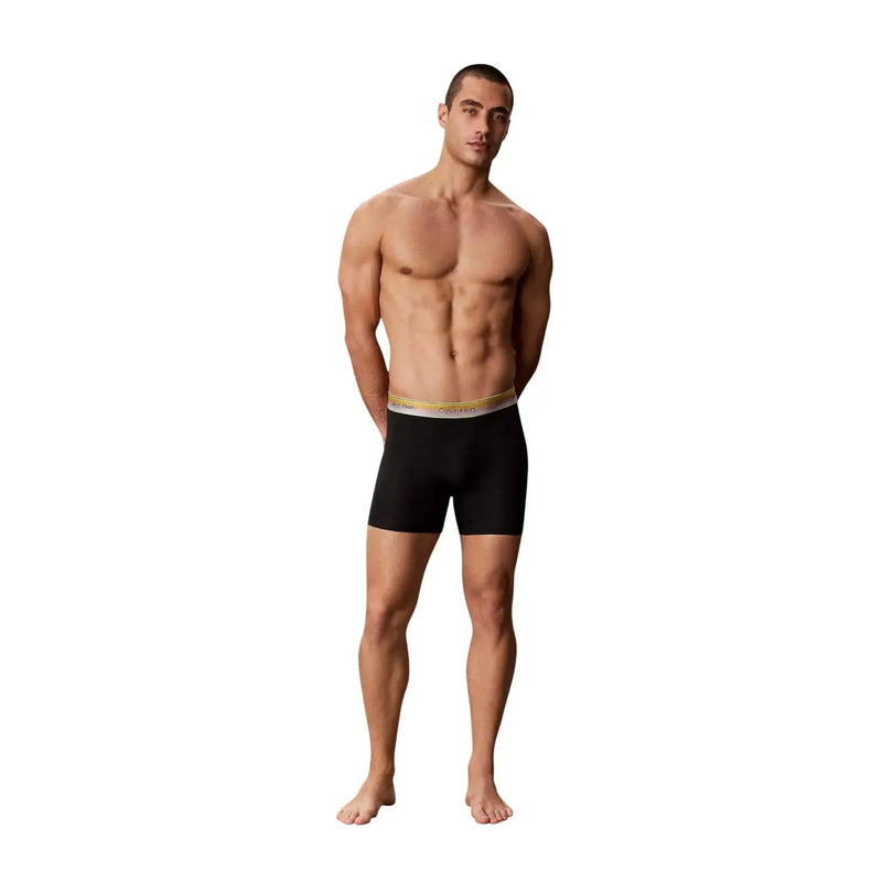Schwarze Calvin Klein Herren-Boxershorts aus Baumwollstretch mit gold-weißem Bund für bequemen Halt