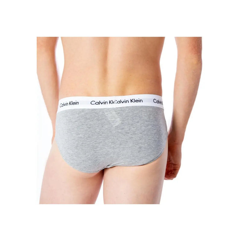 graue Calvin Klein Herren-Boxershorts aus Baumwolle mit weißem Bund und schwarzem Calvin Klein Logo.