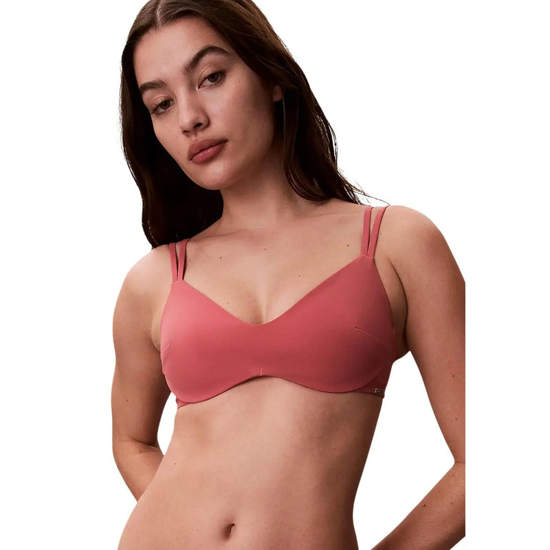 Ein nahtloser Bügel-BH in zartem Rosa mit dünnen, verstellbaren Trägern von Calvin Klein Damen-Strandmode-Bralette-Kollektion
