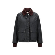 Dunkelgrüner, gewachster Baumwollblazer von Choral für Damen mit bordeauxrotem Cordkragen und -manschetten sowie klassischem Reißverschlusstaschen-Design