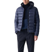 Navy blue down jacket with hood and quilted design, likely from a luxury brand like moncler or loro piana.