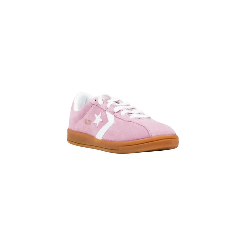 Converse Damen-Sneaker aus Leder, Modell „Classic Ox“, in Pink mit rosa Wildleder, weißem Stern- und Streifenmuster und hellbrauner Gummisohle.