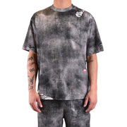 Diesel Schwarzes Herren-T-Shirt aus Baumwolle mit schwarz-grauem Batikmuster und Used-Look-Details an Ärmeln und Saum.