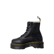 Black leather dr martens ankle boots for women shown from the back side highlighting durable leather material