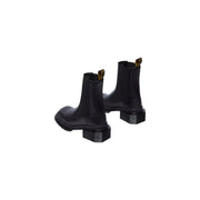 Schwarze Chelsea-Boots aus Leder von Dr. Martens für Damen, Rückseite mit charakteristischer Zuglasche und robuster Sohle.