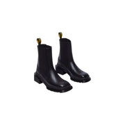 Schwarze Chelsea-Boots aus Leder von Dr. Martens für Damen mit klobigem Blockabsatz und goldfarbenen Zuglaschen
