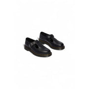 Schwarze Dr. Martens Damen-Slipper aus Leder, von hinten gezeigt, mit glatter Lederoberfläche