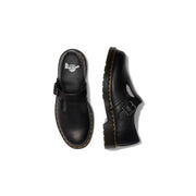 Schwarze Dr. Martens Damen-Slipper aus Leder, von hinten gesehen, mit glattem, schwarzem Leder und Slip-On-Design