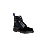 Schwarze Dr. Martens Damenstiefel aus Leder und Samt mit Reißverschluss, von hinten gezeigt, wobei die Designdetails hervorgehoben werden.