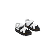 Weiße Dr. Martens Voss II Sandalen für Damen aus Leder mit schwarzen Gummisohlen und silbernen Schnallen.