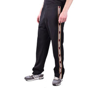 Dsquared Schwarze Herren-Trainingshose aus Baumwollmischgewebe mit markanten vertikalen Streifen und weißem und goldenem Markenlogo.