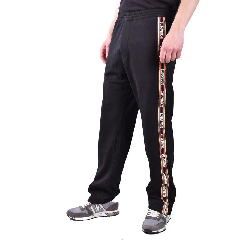 Dsquared Schwarze Herren-Trainingshose aus Baumwollmischgewebe mit markanten vertikalen Streifen und weißem und goldenem Markenlogo.