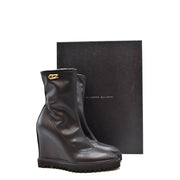 Schwarze Keilstiefeletten von Giuseppe Zanotti für Damen aus Leder mit Blockabsatz und goldfarbenem Logo-Emblem an der Seite