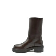 Braune Damen-Ankle-Boots aus Leder von Giuseppe Zanotti mit klobiger schwarzer Gummisohle, von hinten gesehen