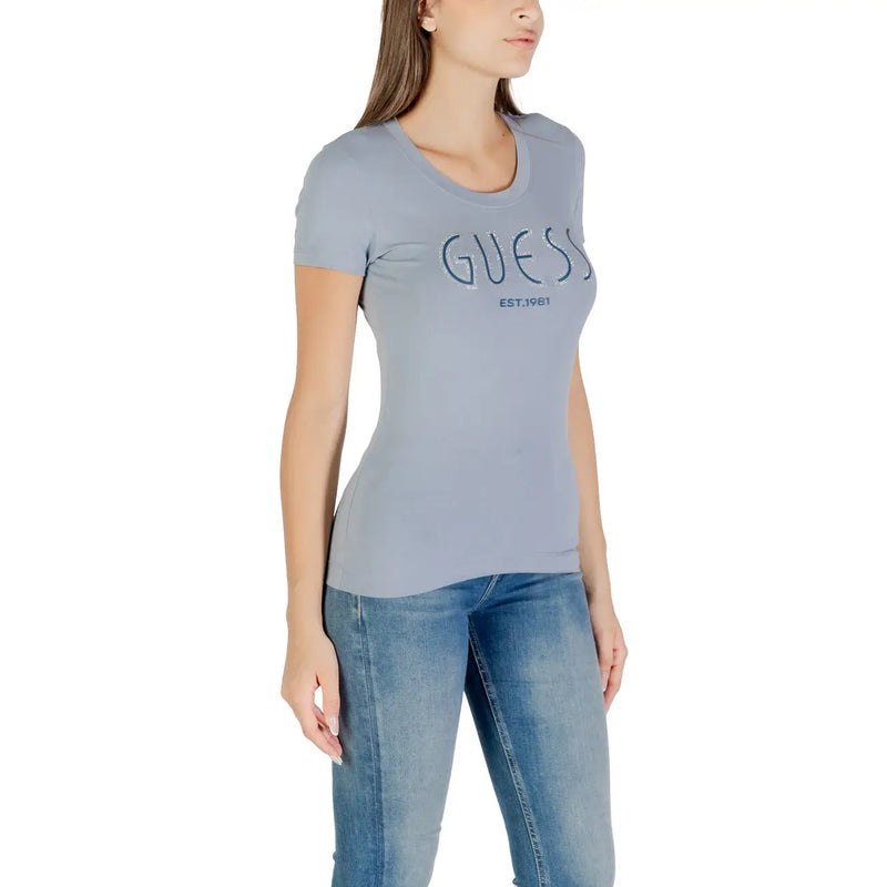 Light blue women’s slim-fit T-shirt with GUESS EST.1981 printed on the front