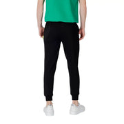 Icon Schwarze, gestreifte Herren-Jogginghose aus Baumwollmischgewebe mit elastischen Bündchen und dezentem gelbem Etikett an der Seitennaht.