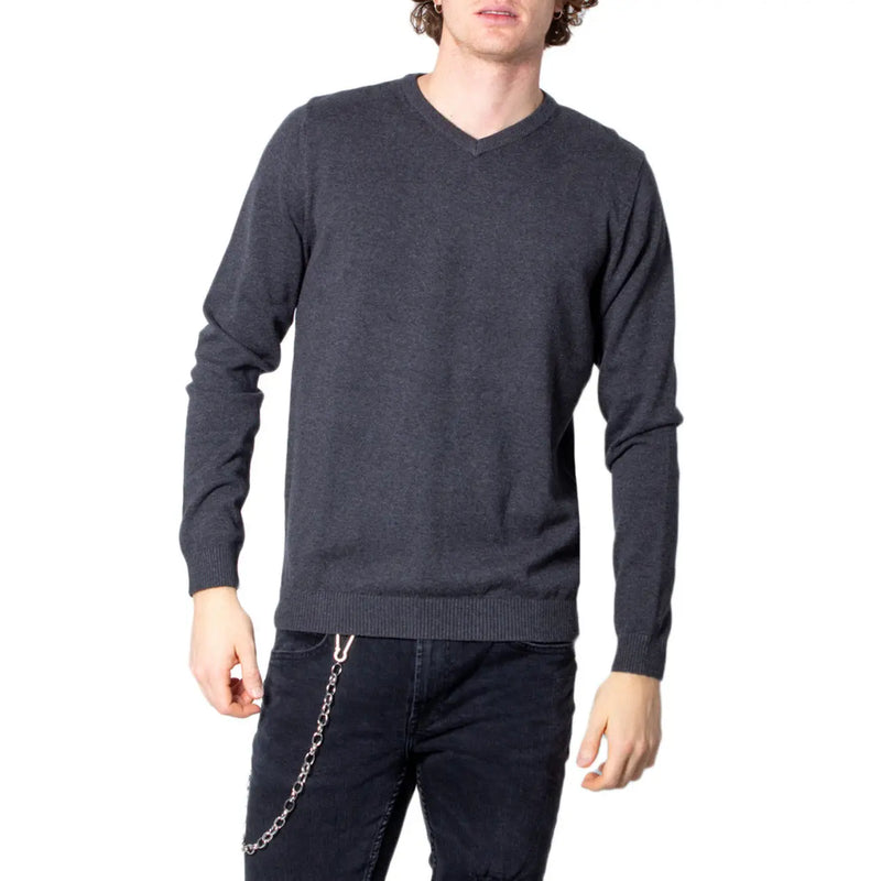 Man wearing Jack & Jones blue V-neck knitwear in a gray V-neck sweater for men