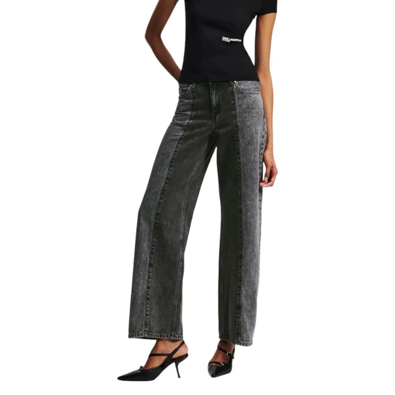 Woman wearing Karl Lagerfeld Black Cotton Jeans with two-tone wash and black slingback heels