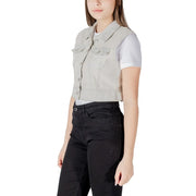 Light gray denim vest with classic collar front button closure and two chest pockets made of durable denim material