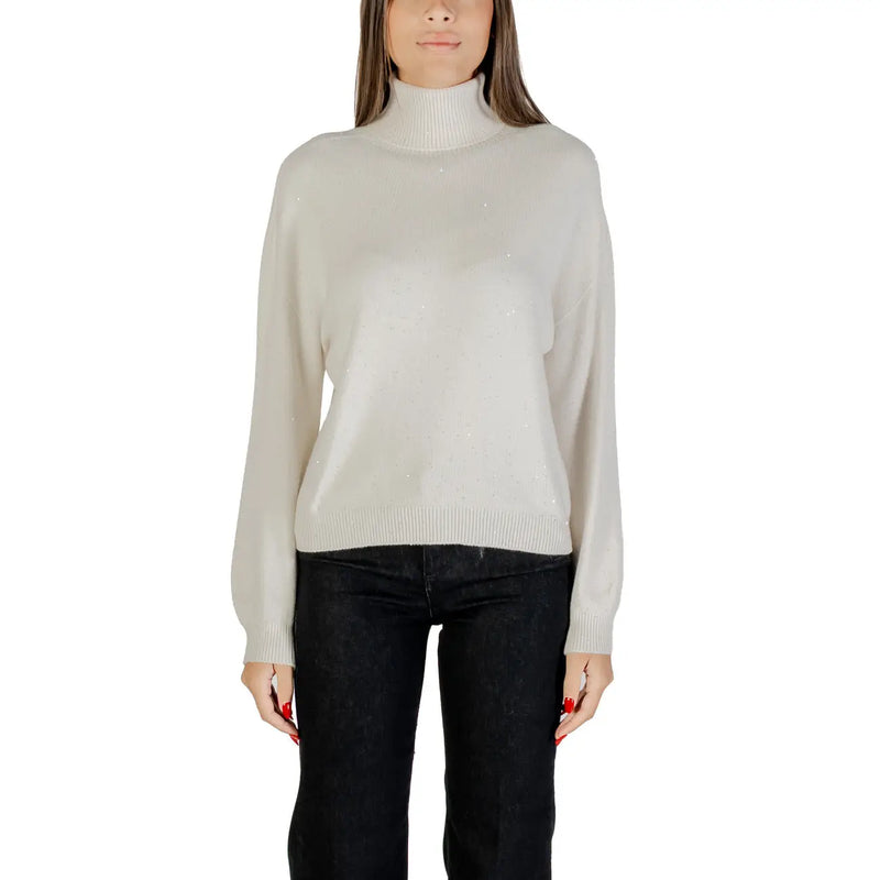 Woman wearing Liu Jo Brown Polka Dot Turtleneck Knitwear in light beige and black pants