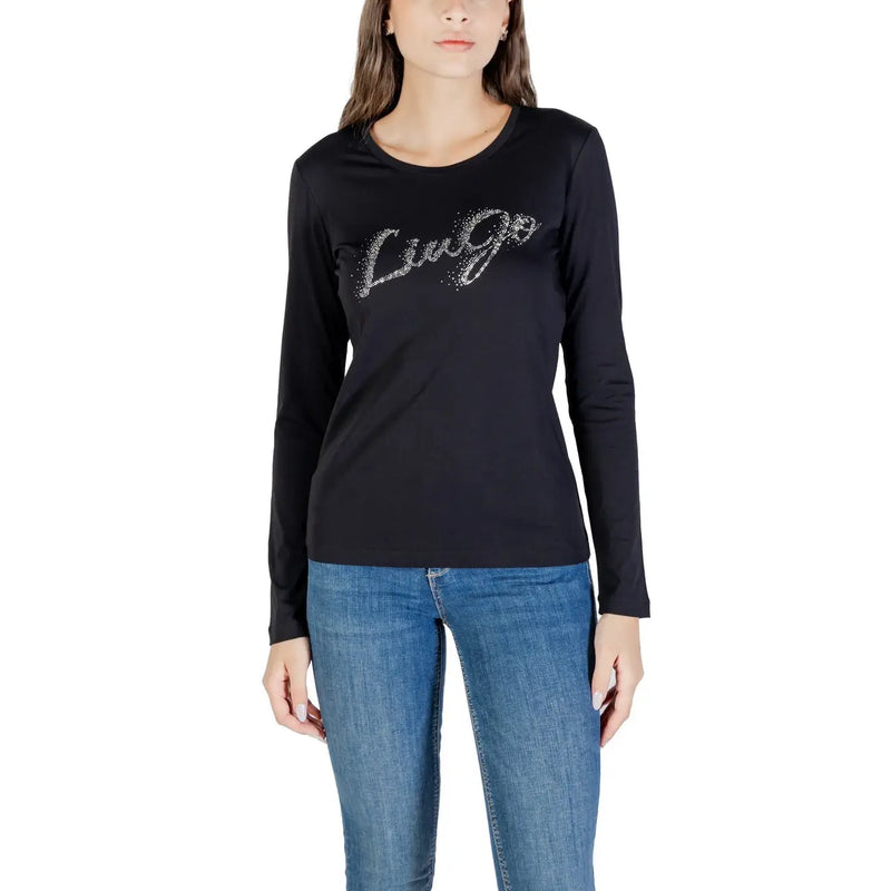 Woman wearing a black long-sleeve Liu Jo T-shirt with a sparkly graphic