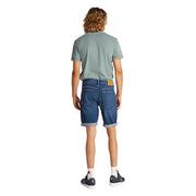 Mens blue denim shorts shown from the back with rolled cuffs and a tan leather brand patch on the waistband