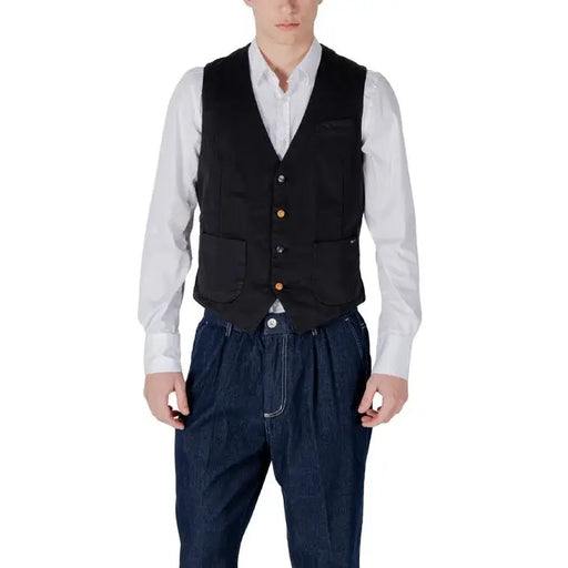 Man in a black vest and blue pants showcasing Men’s Navy Vest and White Shirt