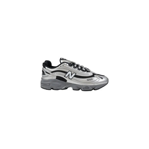 Silver new balance sneaker with black accents and white logo.