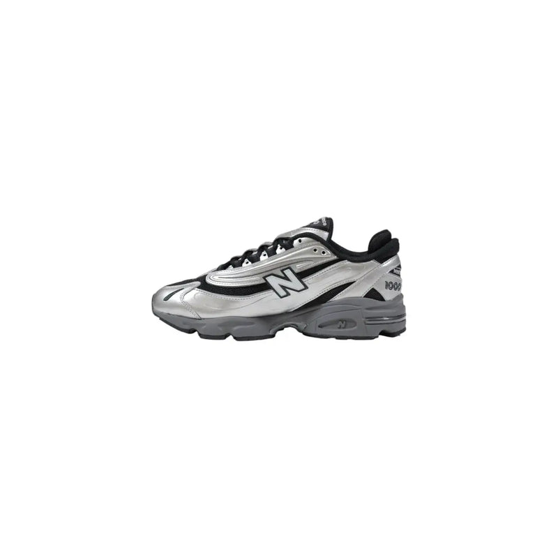 New balance m1000egr silver slip on sneakers men featuring a metallic silver and black upper with rubber sole and classic design