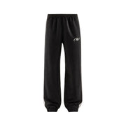 New Balance Schwarze Herren-Jogginghose aus Polyester mit weißen Seitenstreifen und dezentem Logo für Herbst und Winter