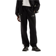 New Balance Schwarze Herren-Jogginghose aus Polyester für Herbst und Winter mit dezentem weißen Logo und grauem Saum an den Beinabschlüssen