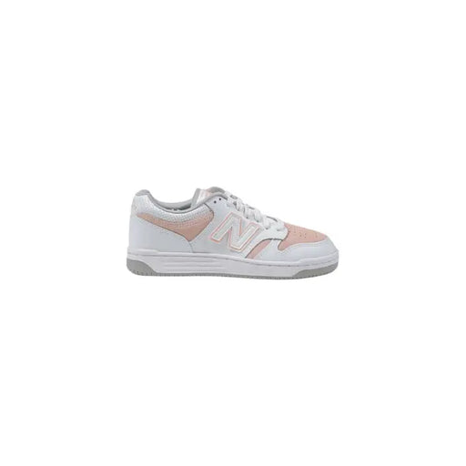 White and pink New Balance women’s sneakers size 3 on display