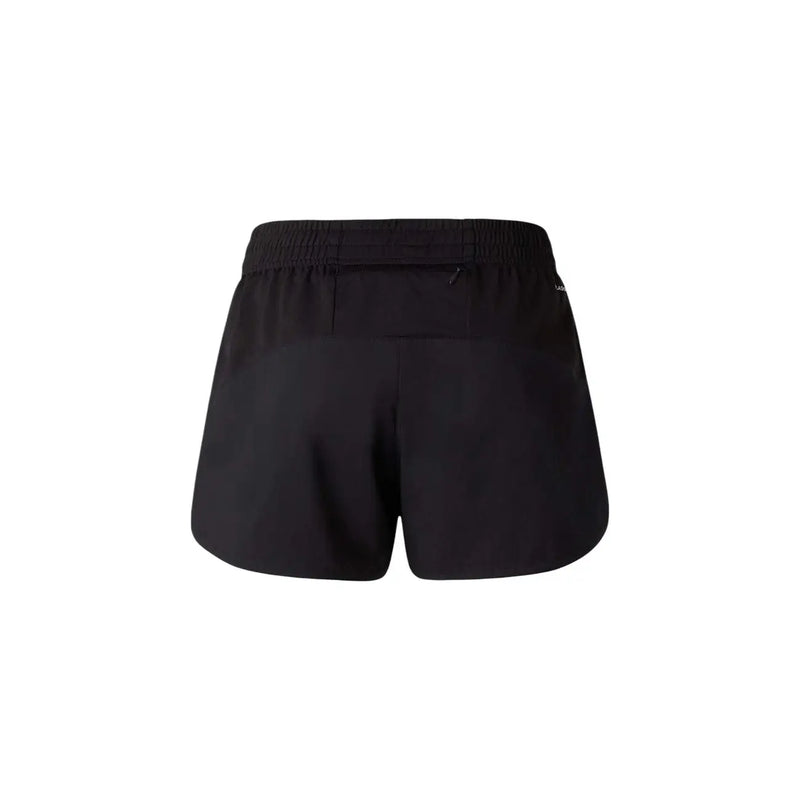 Die Rückseite der schwarzen North Face Damen-Sportshorts aus Polyester mit elastischem Bund und Reißverschlusstasche.