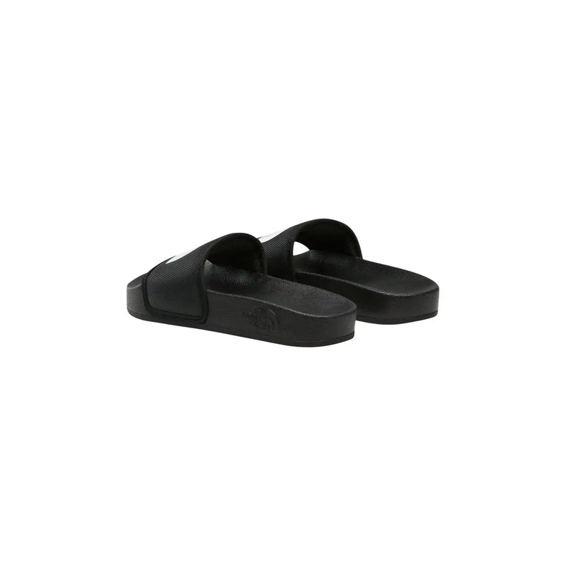 Schwarze Damen-Slipper von The North Face aus Gummi mit minimalistischem Design und dezentem weißen Logo an der Seite.