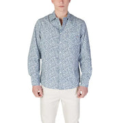Man in patterned long-sleeved shirt and light pants wearing Replay Men’s Light Blue Floral Shirt