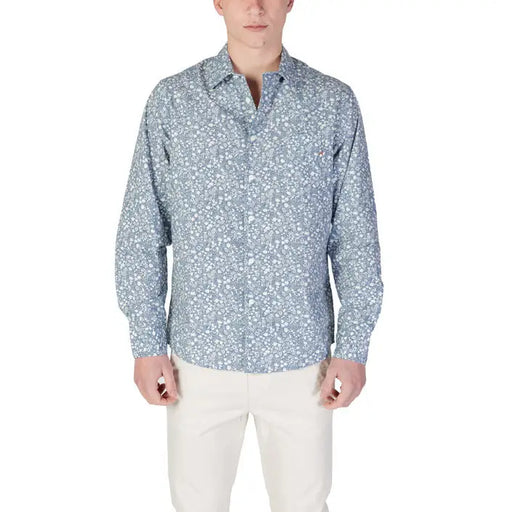 Man in patterned long-sleeved shirt and light pants wearing Replay Men’s Light Blue Floral Shirt